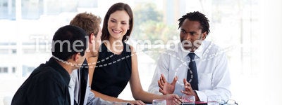 Business team interacting to each other in office