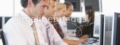 Stock Traders Working At Computers