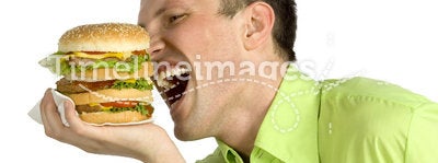 Man eats hamburger