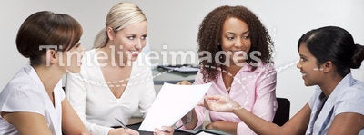Four Modern Businesswomen In Office Meeting