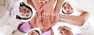 Business people holding hands together in a circle