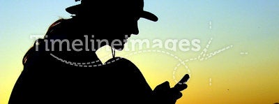 Man with phone on the mountain