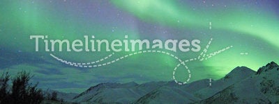 Northern lights over mountains