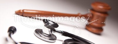 Gavel and Stethoscope on Gradated Background