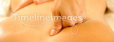 Massage Therapy. Beautiful woman in a spa with massage therapy