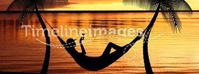 Woman relaxing in a hammock