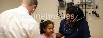 Doctor and Nurse Check Young Patient