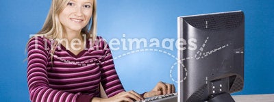 Young blonde woman at the computer