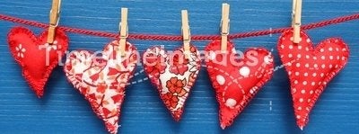 Red hearts with clothespins