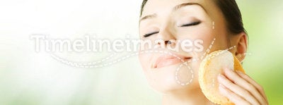 Beautiful Young Woman washing her Face