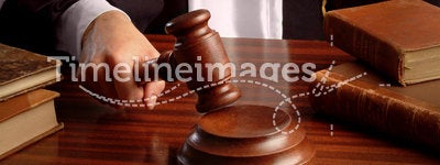 Judge hand with gavel