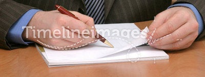 Business man writing on blank paper