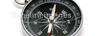 Compass. Lying on white background