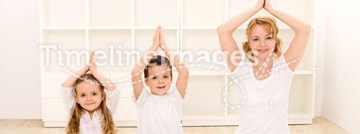 Family doing yoga exercises