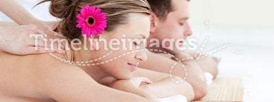 Relaxed young couple receiving a back massage