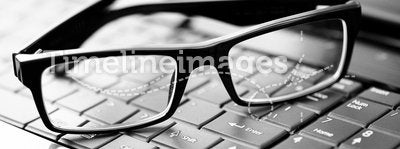 Glasses on laptop