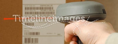 Barcode scaner in hands for a man