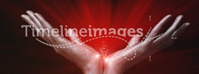 Silver men's hands holding red magic glow