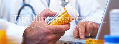 Doctor preparing online internet prescription
