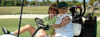 Senior ladies in golf cart