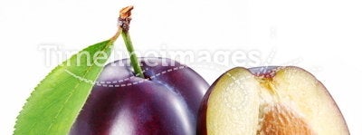 Plum with a slice and leaf