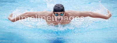 Man swimmer performing the butterfly stroke