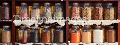 Natural food items and medical herbs in glass jars