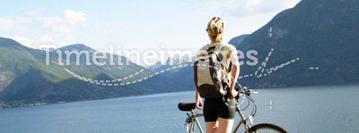 Woman with bike over the fjord