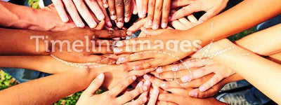 Many hands together: group of people joining hands