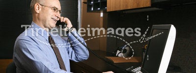 Businessman at desk on phone