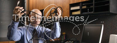 Businessman with cables