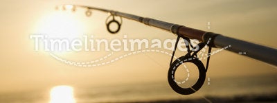 Fishing pole on beach.