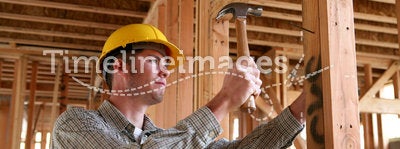 Construction Man Using Hammer
