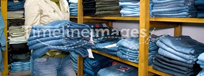 Saleslady in jeans wear shop