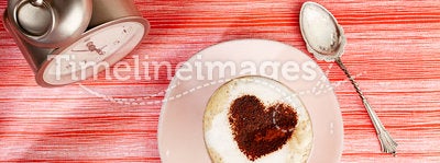 Cappuccino with heart, red stripy backdrop