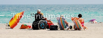 Disabled traveler on beach