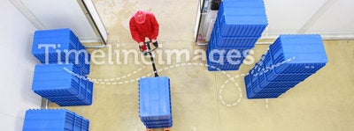 Overhead view of worker working in storehouse