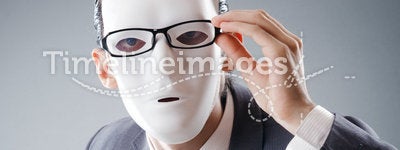 Industrial espionate concept - masked businessman