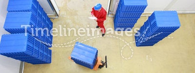Worker preparing goods delivery in warehouse