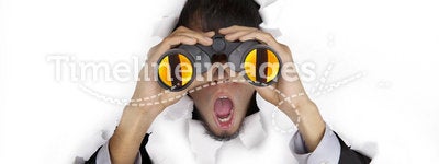 Shocked businessman with binoculars