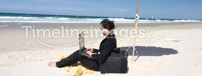 Businesswoman Working at Beach