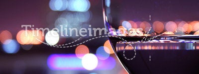 Wine glass with blurred lights