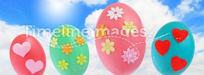 Easter eggs on grass with blue sky