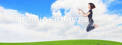 Girl jump and using tablet pc with www cloud