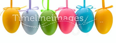 Easter eggs hanging on ribbons. Isolated.