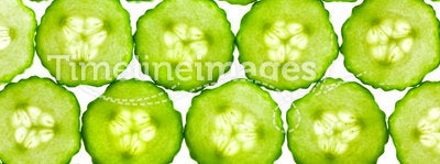 Slices of fresh Cucumber / background / back lit
