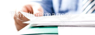 Businessman reading contracts