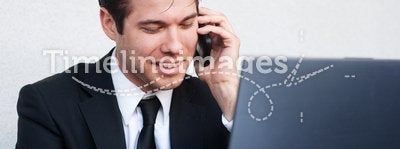Young professional businessman on laptop