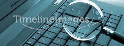 Magnifying glass on laptop