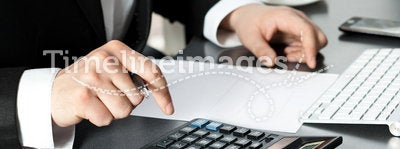 Businessman in office at the computer